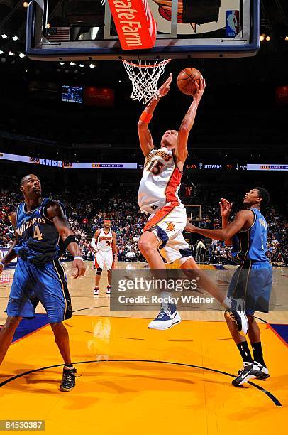 Andris Biedrins of the Golden State Warriors lays up a shot during the game against the Washington Wizards on January 19, 2009 at Oracle Arena in...