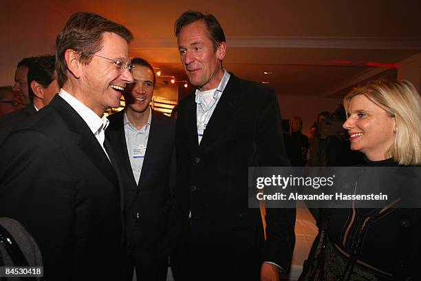 Mathias Doepfner , CEO of Axel Springer AG and his wife Ulrike Doepfner talk to Guido Westerwelle , chairman of the Free Democratic Party at the DLD...