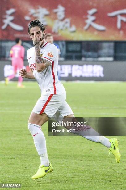 Alexandre Pato of Tianjin Quanjian celebrates after scoring his team's first goal during the 24th round match of 2017 Chinese Football Association...