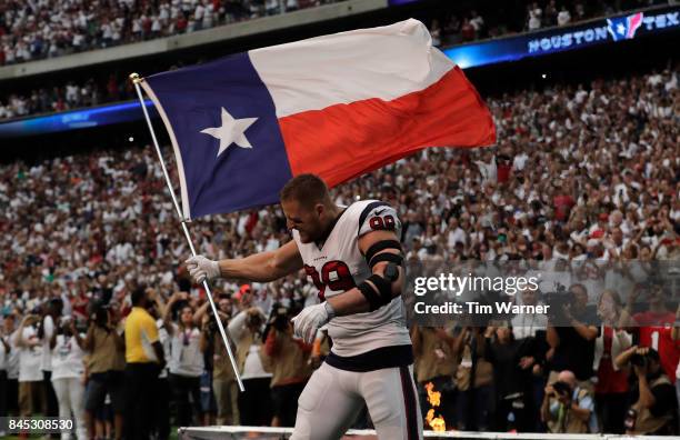 Watt of the Houston Texans enters the field with Texas flag against the Jacksonville Jaguars at NRG Stadium on September 10, 2017 in Houston, Texas.