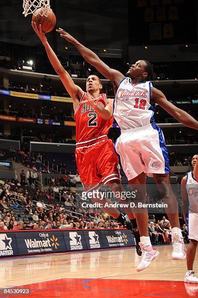 Thabo Sefolosha of the Chicago Bulls goes up for a layup against Al Thornton of the Los Angeles Clippers at Staples Center on January 28, 2009 in Los...