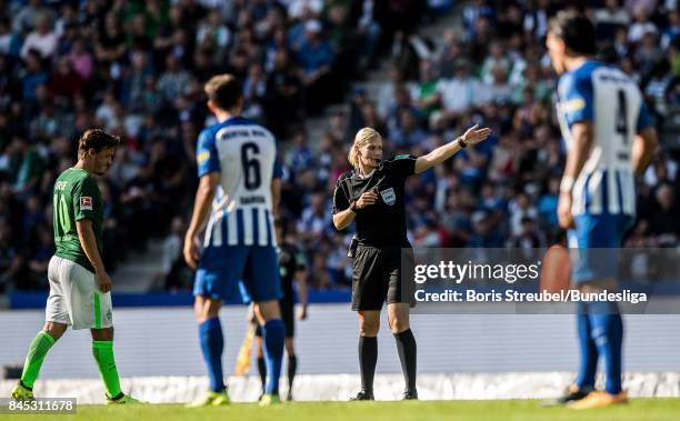 Referee Bibiana Steinhaus gestures during the Bundesliga match between Hertha BSC and SV Werder Bremen at Olympiastadion on September 10, 2017 in...