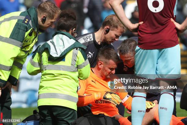 Tom Heaton of Burnley down injured during the Premier League match between Burnley and Crystal Palace at Turf Moor on September 10, 2017 in Burnley,...