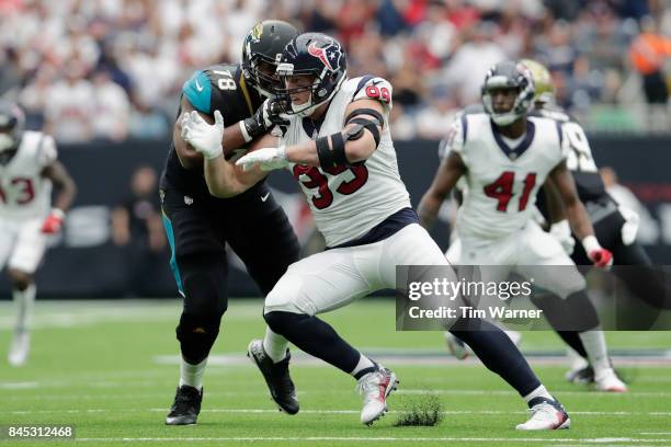 Watt of the Houston Texans rushes the quarterback blocked by Jermey Parnell of the Jacksonville Jaguars in the first quarter at NRG Stadium on...