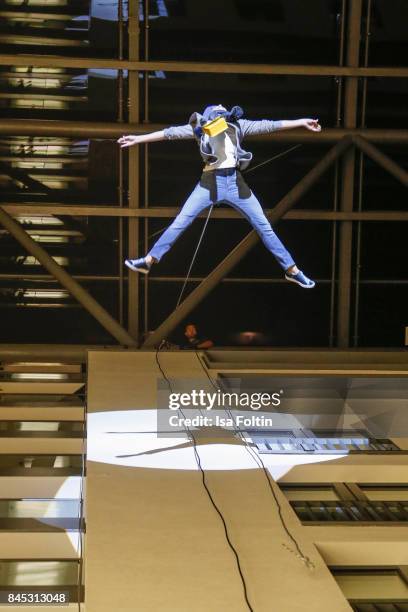 Models perform on the house wall runway at a QVC event during the Vogue Fashion's Night Out on September 8, 2017 in duesseldorf, Germany.