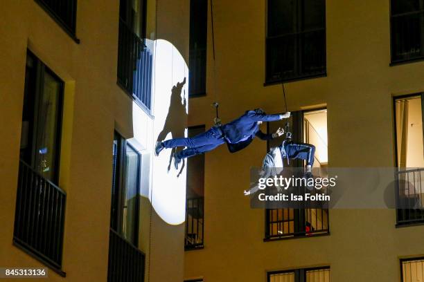 Models perform on the house wall runway at a QVC event during the Vogue Fashion's Night Out on September 8, 2017 in duesseldorf, Germany.