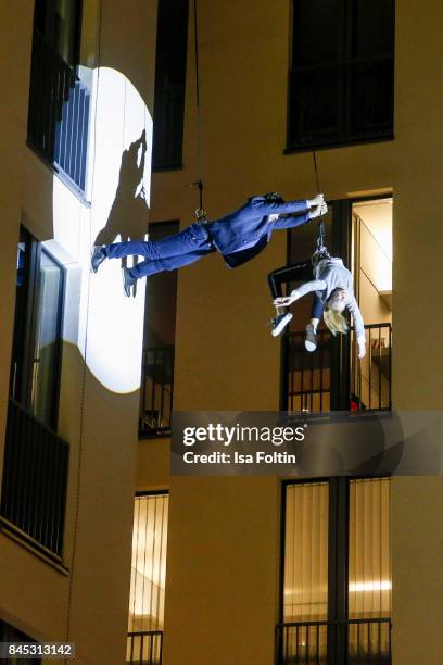 Models perform on the house wall runway at a QVC event during the Vogue Fashion's Night Out on September 8, 2017 in duesseldorf, Germany.