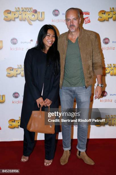 Singer Anggun and Christian Kretschmar attend the "Le Petit Spirou" Paris Premiere at Le Grand Rex on September 10, 2017 in Paris, France.