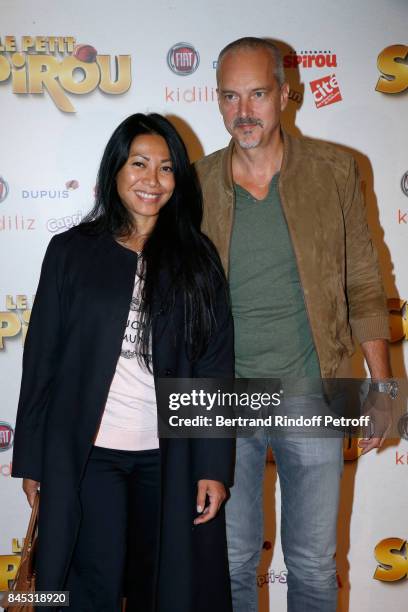 Singer Anggun and Christian Kretschmar attend the "Le Petit Spirou" Paris Premiere at Le Grand Rex on September 10, 2017 in Paris, France.