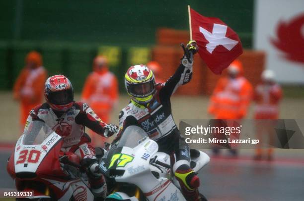 Dominique Aegerter of Switzerland and Kiefer Racing celebrates the victory with the flag at the end of the Moto2 Race during the MotoGP of San Marino...