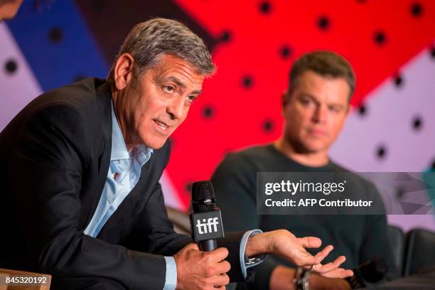 Director George Clooney speaks next to Matt Damon during the press conference for 'Suburbicon' at the Toronto International Film Festival in Toronto,...