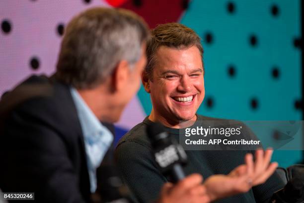 George Clooney jokes with Matt Damon during the press conference for 'Suburbicon' at the Toronto International Film Festival in Toronto, Ontario,...