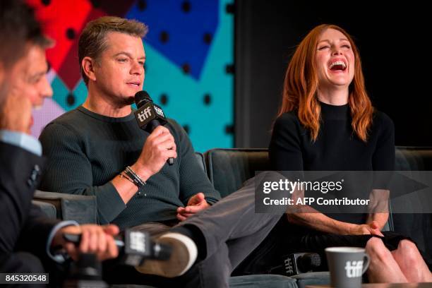 Matt Damon speaks next to Julianne Moore during the press conference for 'Suburbicon' at the Toronto International Film Festival in Toronto, Ontario...