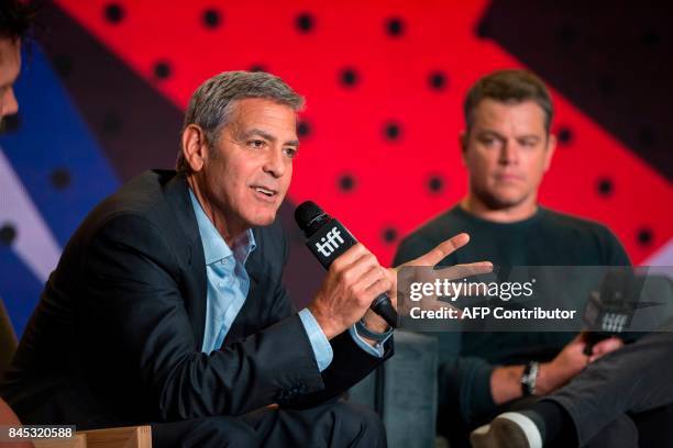 Director George Clooney speaks next to Matt Damon during the press conference for 'Suburbicon' at the Toronto International Film Festival in Toronto,...