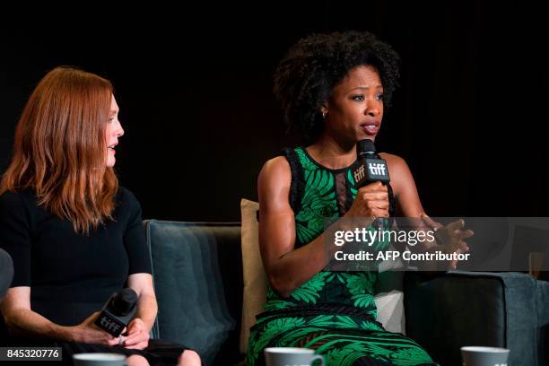 Julianne Moore looks on as Karimah Westbrook speaks during the press conference for 'Suburbicon' at the Toronto International Film Festival in...