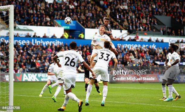 Jamaal Lascelles of Newcastle United scores his sides first goal during the Premier League match between Swansea City and Newcastle United at Liberty...