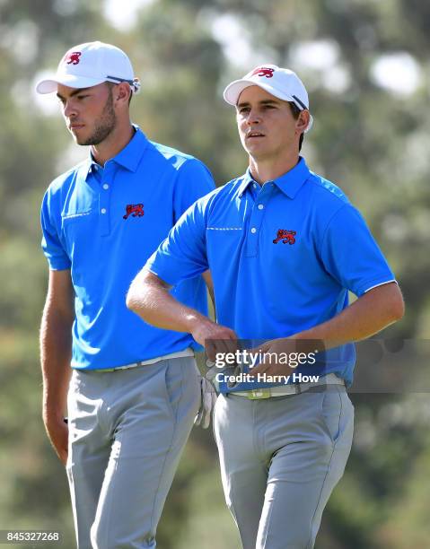 David Boote and Jack Davidson of Team Great Britain and Ireland leaves the seventh green losing to Cameron Champ and Will Zalatoris of Team USA six...