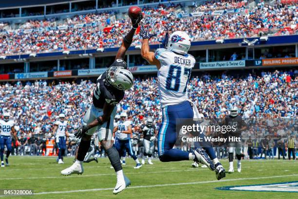 Safety Karl Joseph of the Oakland Raiders deflects a pass intended for wide receiver Eric Decker of the Tennessee Titans in the first half at Nissan...