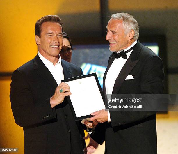 Arnold Schwarzenegger and Dietrich Mateschitz present the Taurus Honorary Award for Action Director of the Year