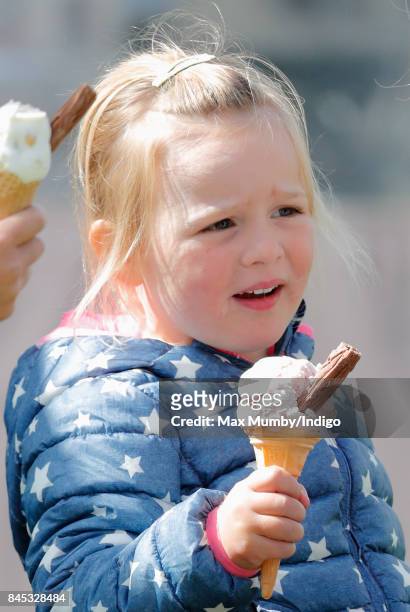 Mia Tindall eats an ice cream as she attends the Whatley Manor Horse Trials at Gatcombe Park on September 9, 2017 in Stroud, England.