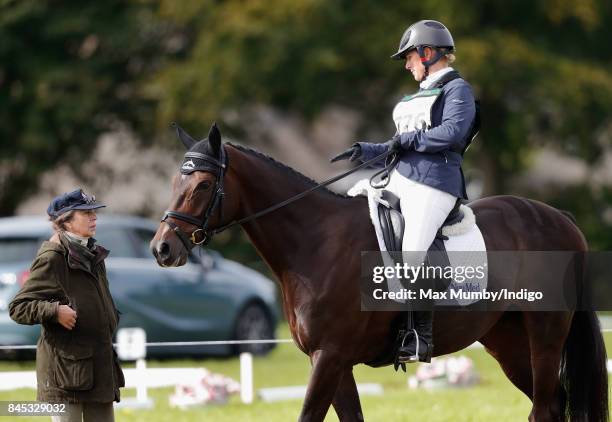 Zara Phillips talks with her mother Princess Anne, Princess Royal after competing on her horse 'Gladstone' in the dressage phase of the Whatley Manor...