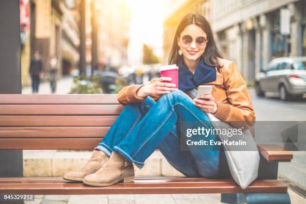 beautiful woman spending time in the city - hipster coffee shop candid stock pictures, royalty-free photos & images