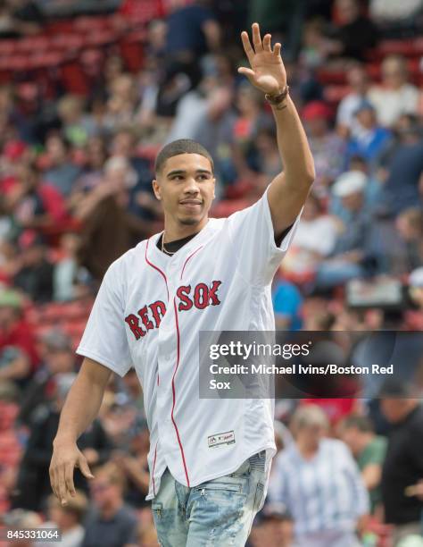 Boston Celtics first round draft pick Jason Tatum waves to the crowd before throwing out a ceremonial first pitch at a game between the Boston Red...