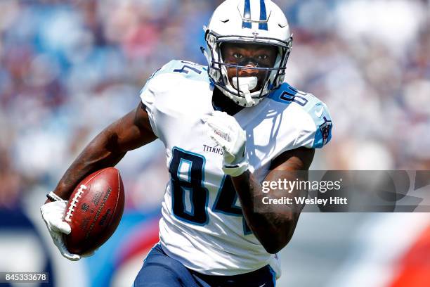 Wide receiver Corey Davis of the Tennessee Titans runs the ball against the Oakland Raiders in the first half at Nissan Stadium on September 10, 2017...