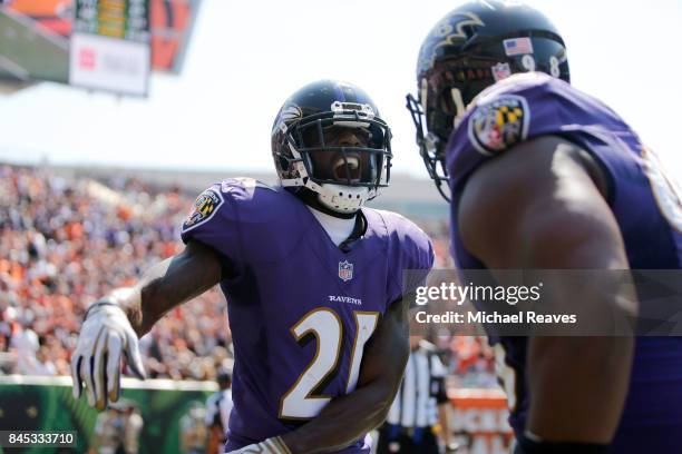 Lardarius Webb of the Baltimore Ravens celebrates after making an interception during the second quarter of the game against the Cincinnati Bengals...