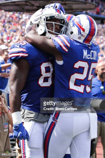 Charles Clay of the Buffalo Bills and teammate LeSean McCoy celebrate after Clay scored a touchdown during the first half against the New York Jets...