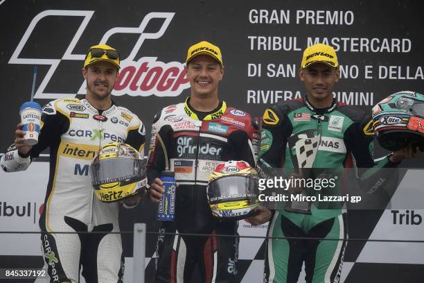 Thomas Luthi of Switzerland and Carxpert Interwetten; Dominique Aegerter of Switzerland and Kiefer Racing; and Hafizh Syahrin of Malaysia and...