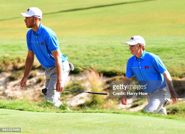 David Boote and Jack Davidson of Team Great Britain and Ireland make their way to the seventh green. The pair would lose to Cameron Champ and Will...