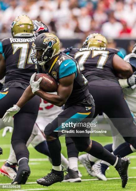 Jacksonville Jaguars running back Leonard Fournette carries the ball during the NFL game between the Jacksonville Jaguars and Houston Texans on...