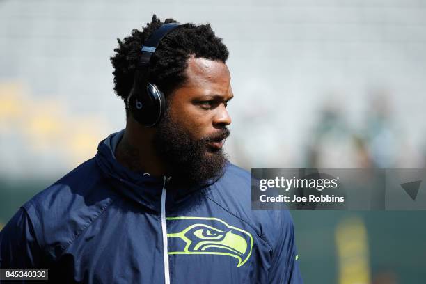 Michael Bennett of the Seattle Seahawks looks on before the game against the Green Bay Packers at Lambeau Field on September 10, 2017 in Green Bay,...