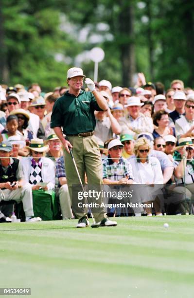 Tom Kite looks down the fairway from the tee box in front of a large gallery during the 1997 Masters Tournament at Augusta National Golf Club on...