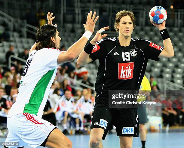 Sven-Soeren Christophersen of Germany passes the ball during the Men's World Handball Championships placement match of place five between Hungary and...