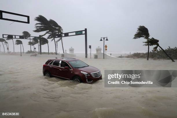 Car sits abandoned in storm surge along North Fort Lauderdale Beach Boulevard as Hurricane Irma hits the southern part of the state September 10,...