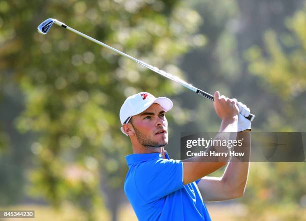 Jack Davidson of Team Great Britain and Ireland watches his tee shot on the ninth hole. Davidson and David Boote would lose to Cameron Champ and Will...