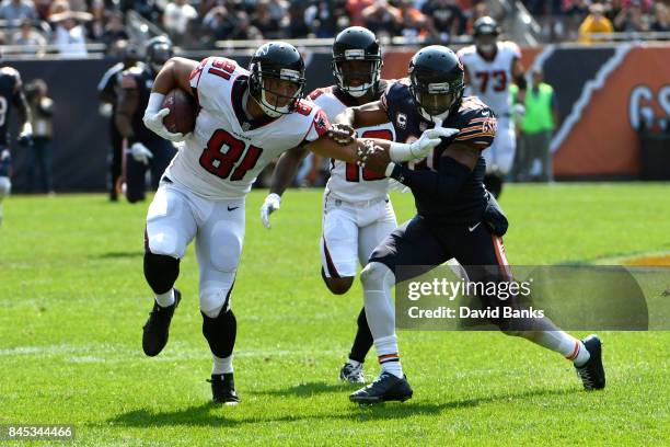 Austin Hooper of the Atlanta Falcons carries the football toward the endzone against Quintin Demps of the Chicago Bears in the fourth quarter at...