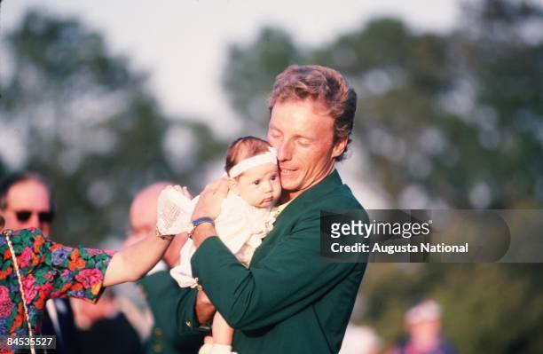 Masters Champion Bernhard Langer holds his new daughter Christina at the Presentation Ceremony during the 1993 Masters Tournament at Augusta National...