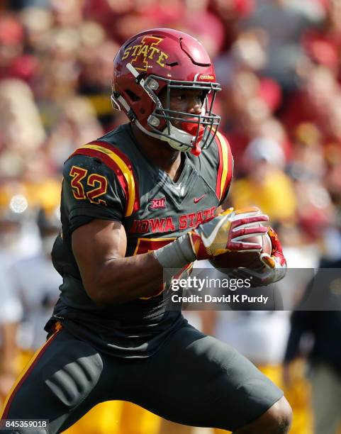 Running back David Montgomery of the Iowa State Cyclones rushes for yards in the first half of play against the Iowa Hawkeyes at Jack Trice Stadium...