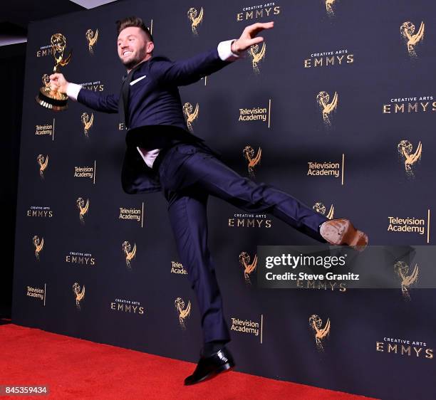 Travis Wall poses at the 2017 Creative Arts Emmy Awards - Day 1 - Press Room at Microsoft Theater on September 9, 2017 in Los Angeles, California.