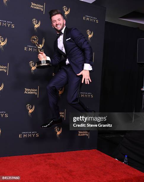 Travis Wall poses at the 2017 Creative Arts Emmy Awards - Day 1 - Press Room at Microsoft Theater on September 9, 2017 in Los Angeles, California.