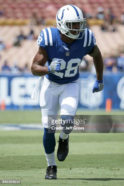 Chris Milton of the Indianapolis Colts is warms up before the game between the Los Angeles Ram and Indianapolis Colts at the Los Angeles Memorial...