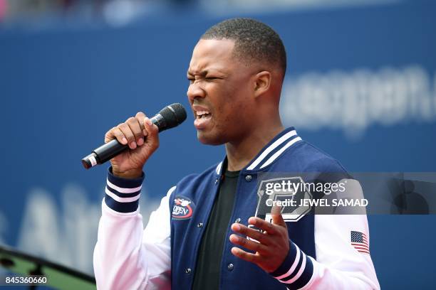 Actor Corey Hawkins sings the national anthem before the start of the 2017 US Open Men's Singles final match between Spain's Rafael Nadal and South...
