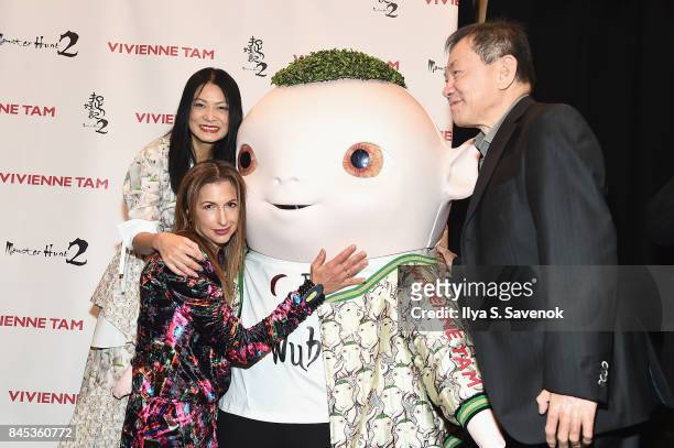 Designer Vivienne Tam, actress Alysia Reiner and producer William Kong pose with Wuba backstage for Vivienne Tam fashion show during New York Fashion...