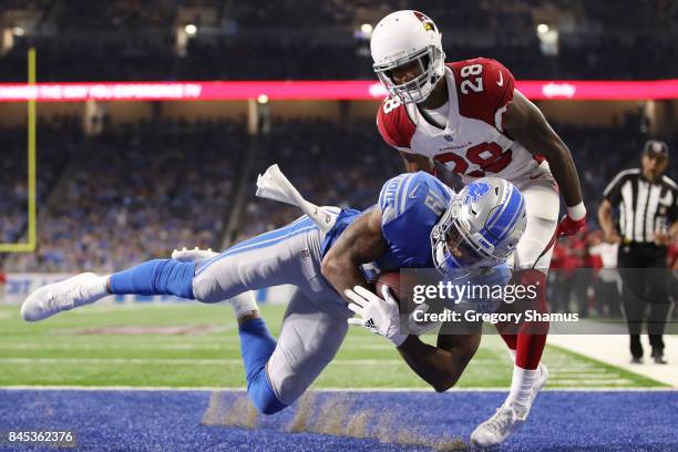 Kenny Golladay of the Detroit Lions scores a touch down in the second half against Justin Bethel of the Arizona Cardinals at Ford Field on September...