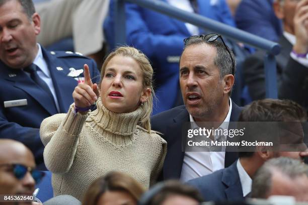 Jerry Seinfeld and his wife Jessica Seinfeld look on in the stands before the Men's Singles finals match between Kevin Anderson of South Africa and...