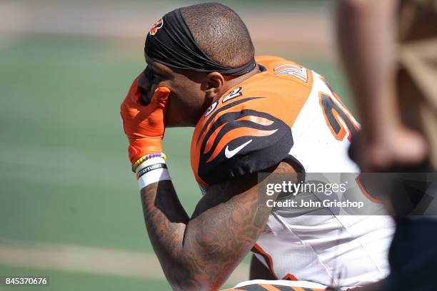 Jeremy Hill of the Cincinnati Bengals sits on the sideline during the fourth quarter of the game against the Baltimore Ravens at Paul Brown Stadium...