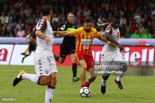Player of Benevento Calcio Marco D'Alessandro vies with Torino FC Acquah Afriyie during the Serie A match between Benevento Calcio and Torino FC at...